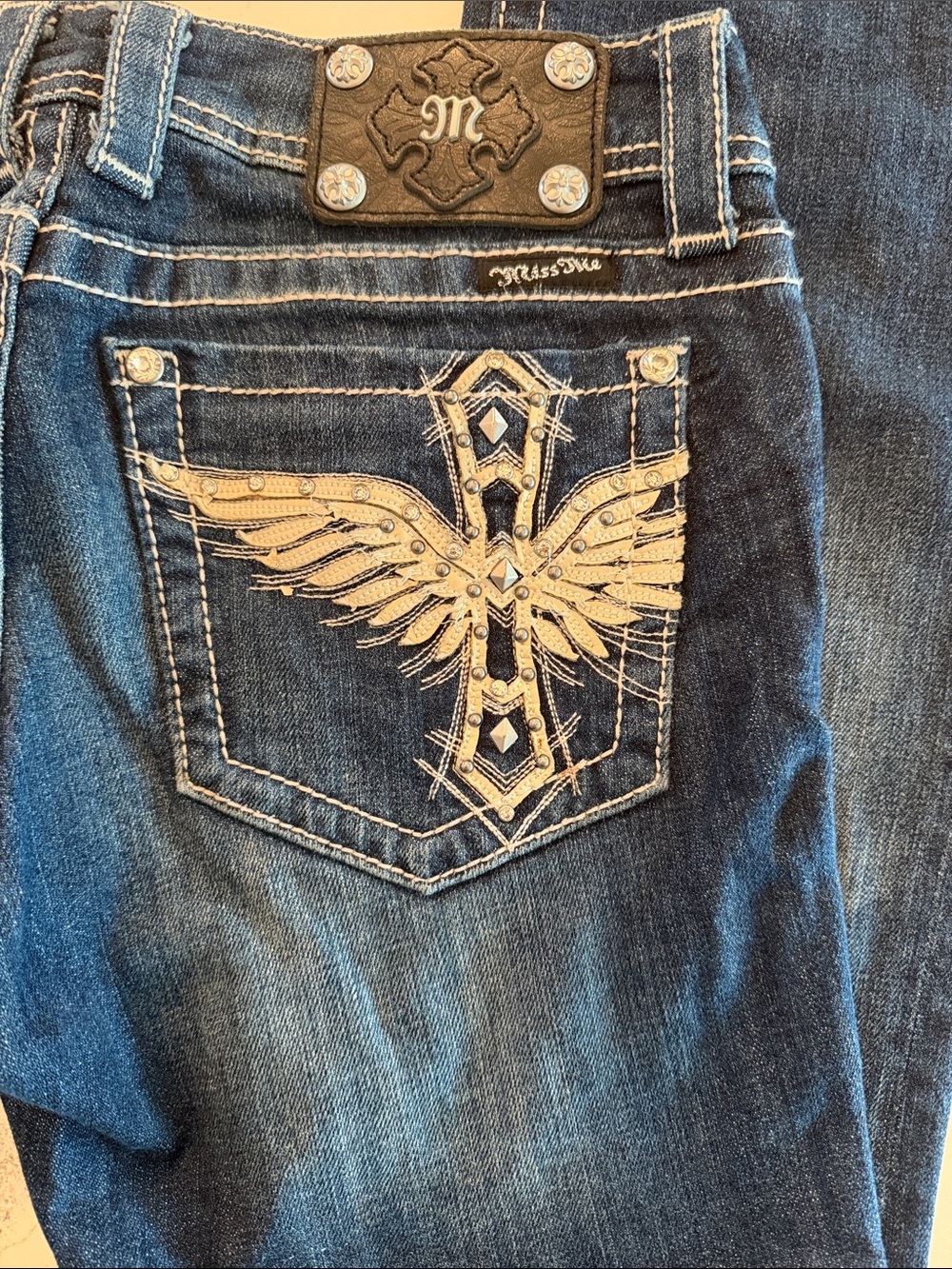 Miss Me Men Dark Blue Jeans with Tan Embroidered Wing Pocket